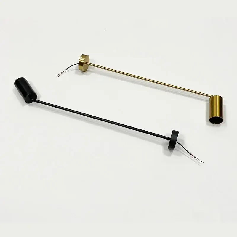 Modern black and brass directional light pendant light with gu10 led bulb featuring cylindrical ends and exposed wiring