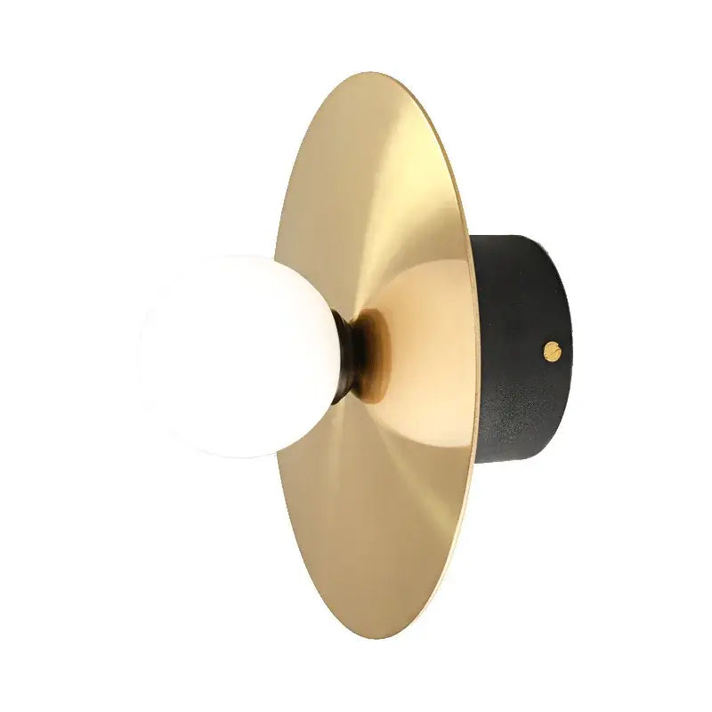 Modern black and brass glass ball light fixture wall sconce with matte black base and exposed frosted bulb decorbites golden glass