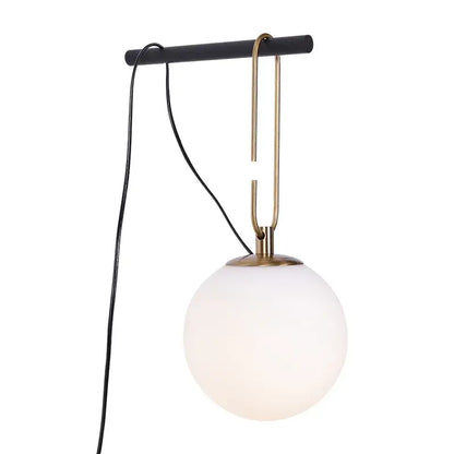 Minimalist pendant light with frosted glass ball shade and brass hook from a matte black bar for bedroom decorbites decor
