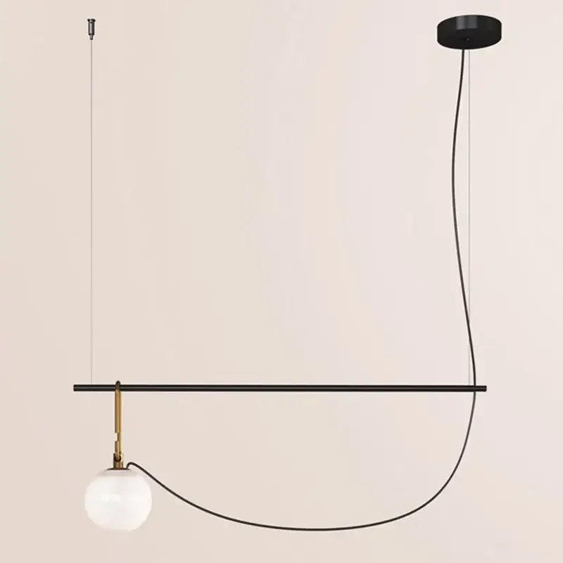 Minimalist black metal pendant light with frosted glass ball and brass accents ideal for bedroom decorbites decor