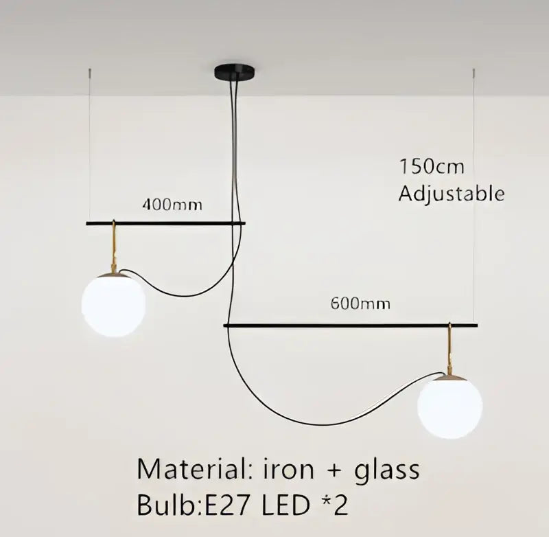 Adjustable modern black and brass pendant light with two glass ball bulbs suspended from iron frame for bedroom decorbites decor