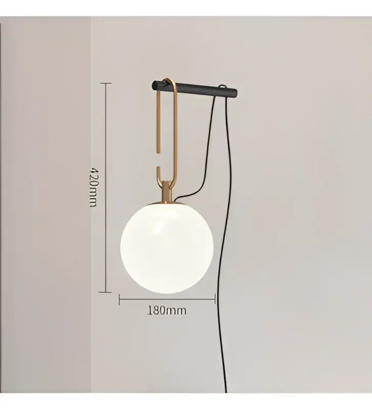 Modern black and brass pendant light with a glass ball globe ideal for bedroom 3-light decorbites glass ball fixture