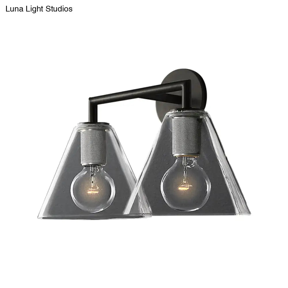 Modern black metal wall light with two clear glass cone shades and exposed filament bulbs direct wired electric