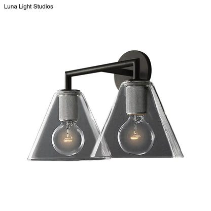 Modern black metal wall light with two clear glass cone shades and exposed filament bulbs direct wired electric