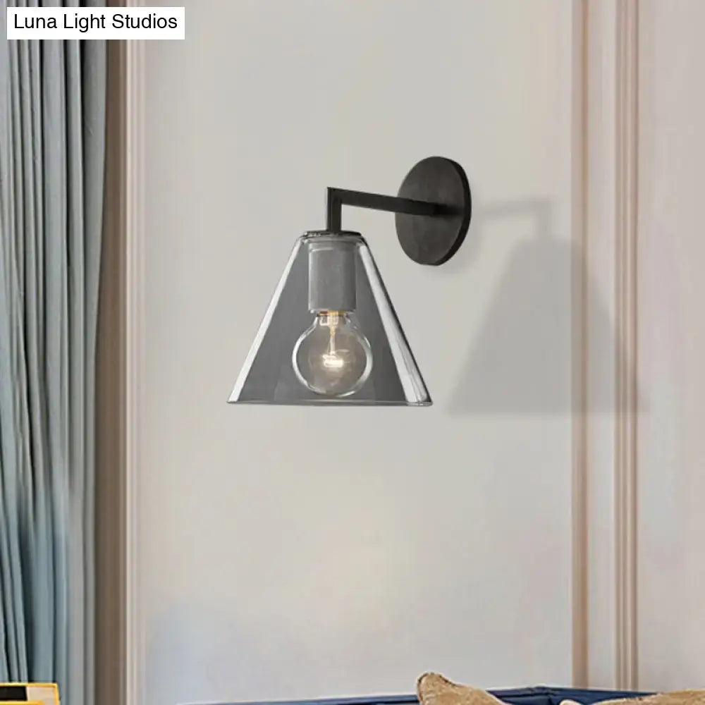 Modern black metal wall light with brass glass cone shade and exposed bulb direct wired electric for bedroom use