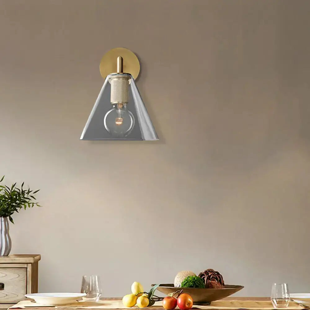 Modern black and brass glass cone wall light with brushed brass backplate and exposed bulb direct wired electric