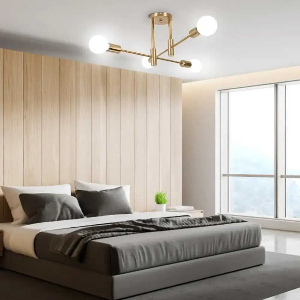 Modern black and brass decorbites industrial chandelier with gold-toned frame and four spherical white LED bulbs for living room decor