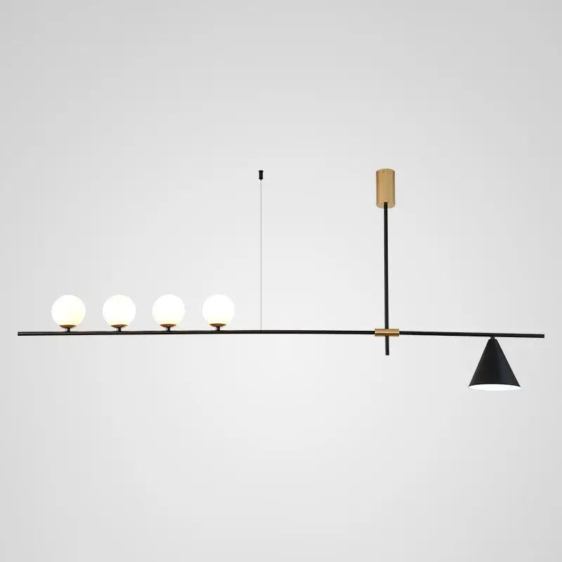 Modern black and brass linear chandelier with spherical white glass bulbs and one conical shade for dining room lighting