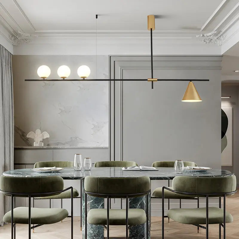 Modern black and brass linear chandelier with spherical white glass bulbs and a gold-toned conical shade suspended by black rods