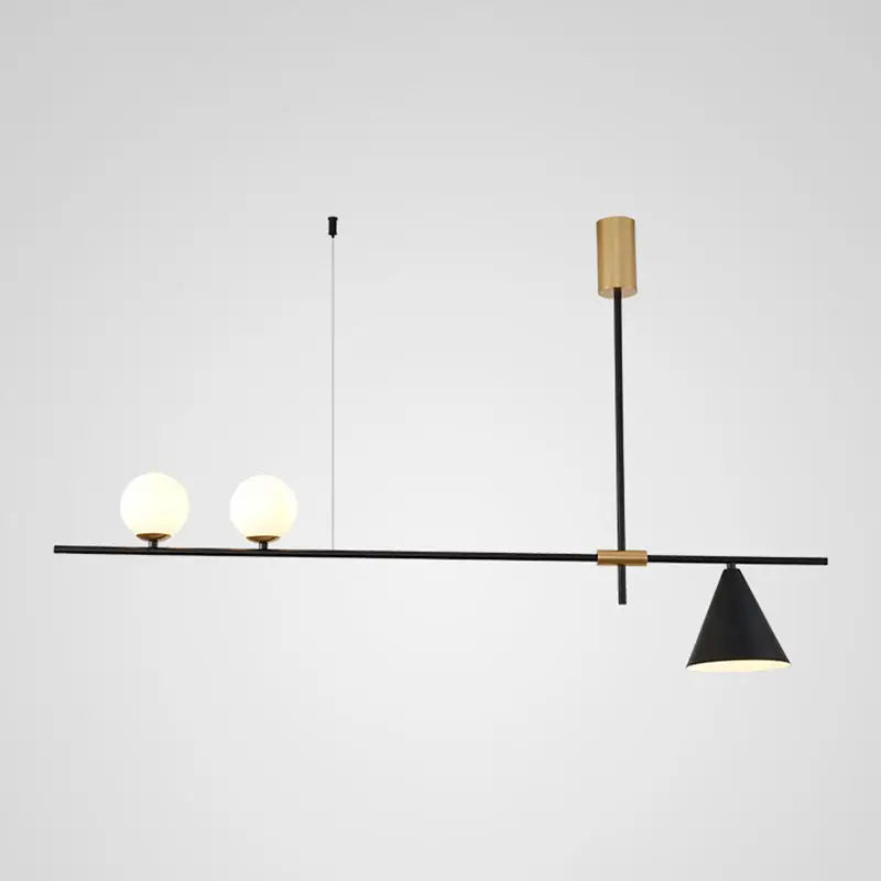 Modern black and brass linear chandelier with spherical white glass bulbs and a conical shade for dining room lighting
