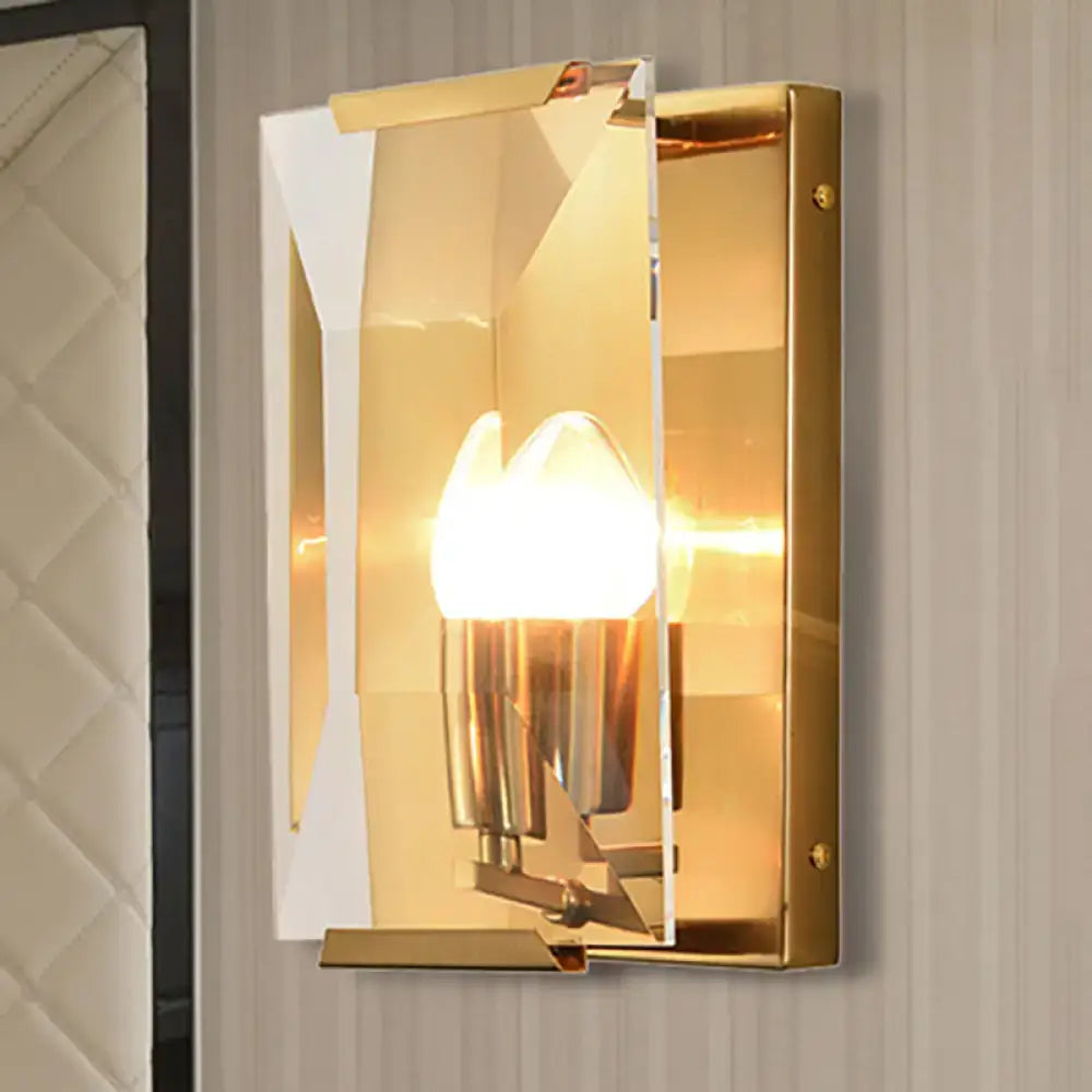Modern black brass sconce light with gold-toned geometric design featuring clear acrylic panels and polished metal accents
