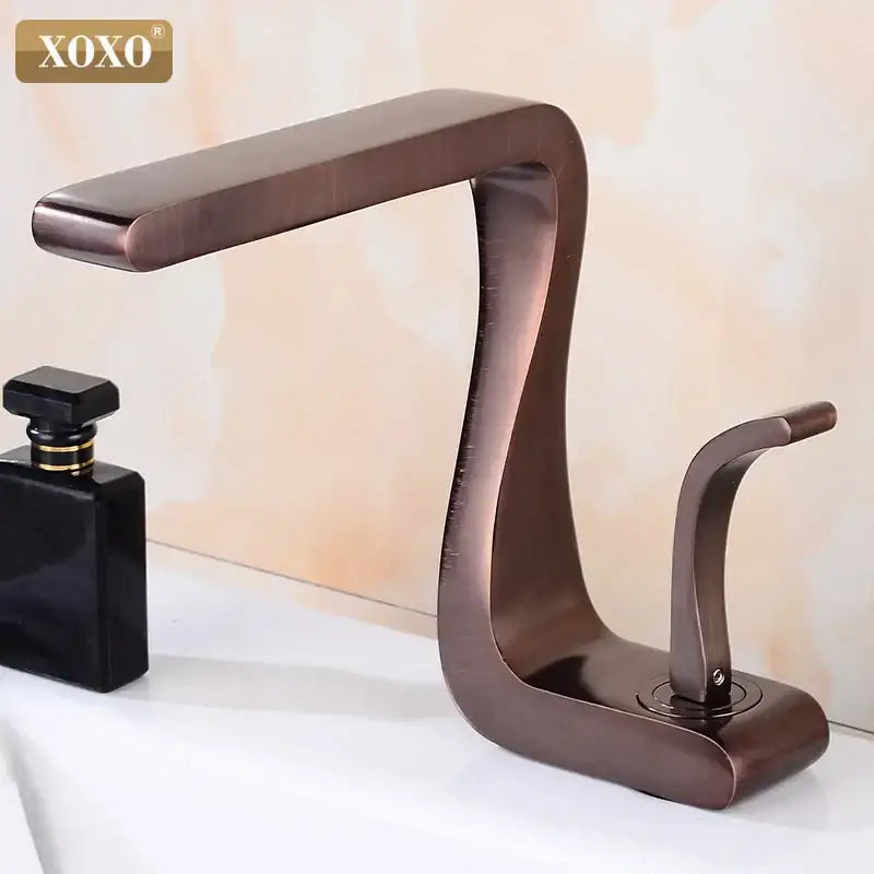Bronze-finished decorbites black brass basin faucet with a sleek curved design and single handle for bathroom sink