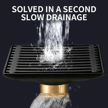 Modern black brass square shower floor drain with gold-colored pipe base and horizontal slats decorbites brass square