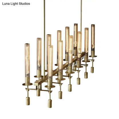 Brass-toned tube island chandelier with black brass finish and cylindrical glass tubes featuring exposed filament bulbs