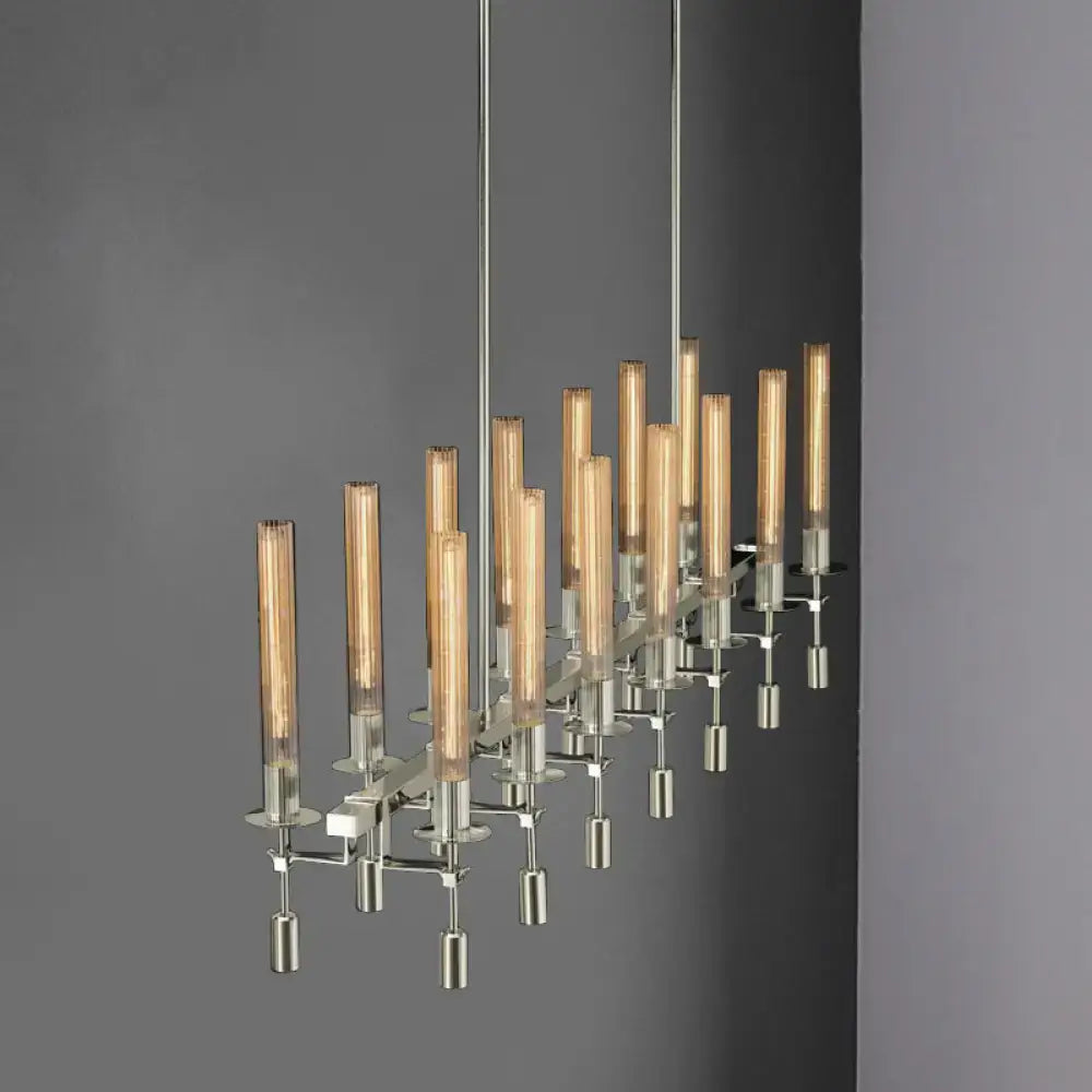 Modern chrome-finished tube island chandelier with black brass and nickel accents featuring amber fluted glass bulbs