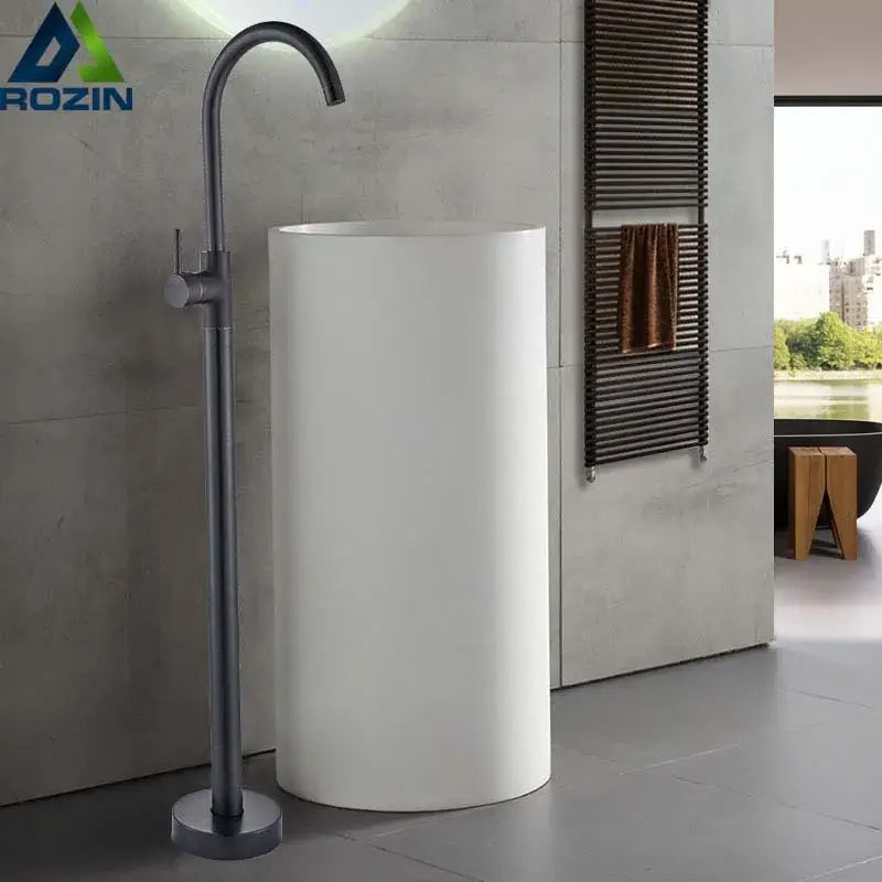 Modern white cylindrical pedestal sink with decorbites black bronze bath shower rotate spout faucet in dark gray matte finish