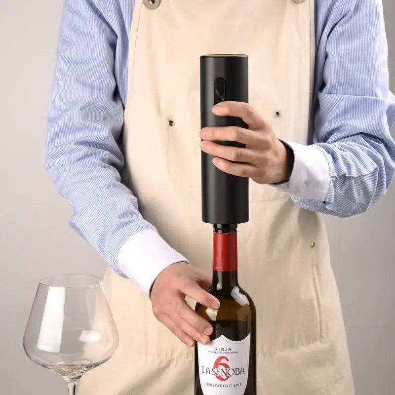 Modern black brushed metal electric wine opener with cylindrical design for effortless wine opening