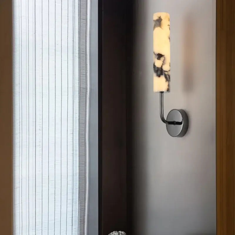 Modern black carbon steel led wall lamp with alabaster bedroom shade featuring a sleek chrome arm decorbites carbon steel