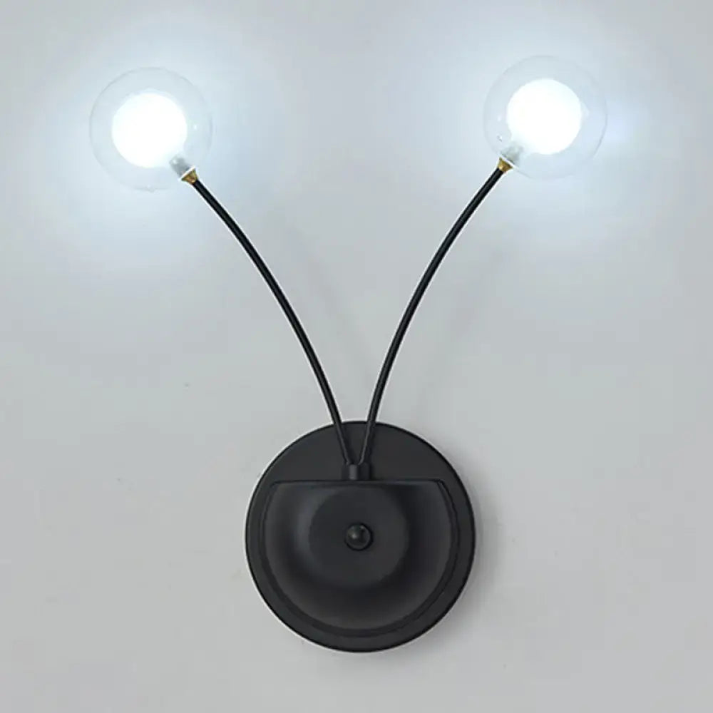 Modern black cast iron double globe wall sconce with two curved arms and clear bulbs for living room lighting fixture inches