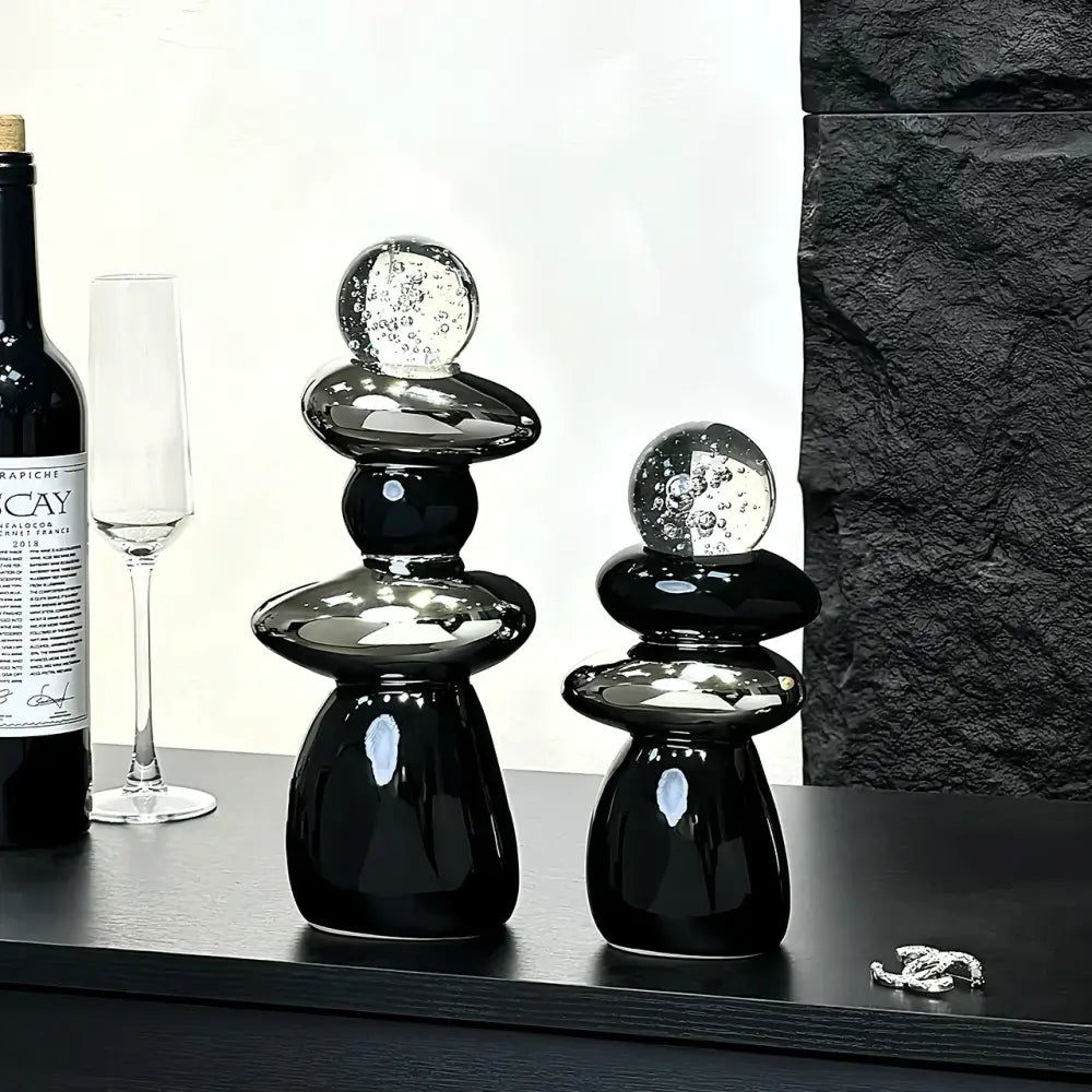 Modern black ceramic decorative crystal ball statue with stacked rounded forms and clear glass orbs for living room decor