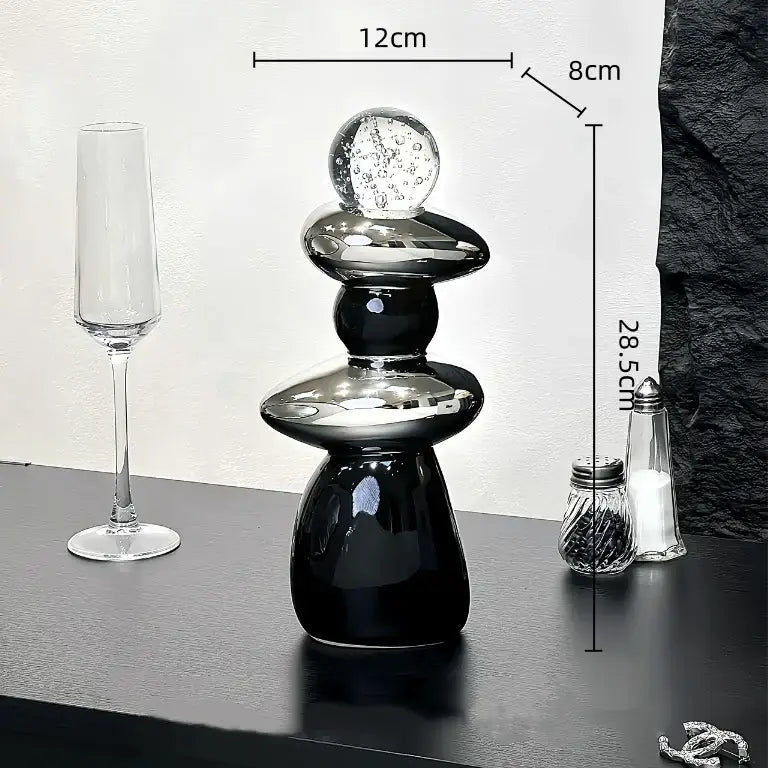 Modern black ceramic decorative crystal ball statue with stacked rounded tiers and a clear glass bubble top for living room decor