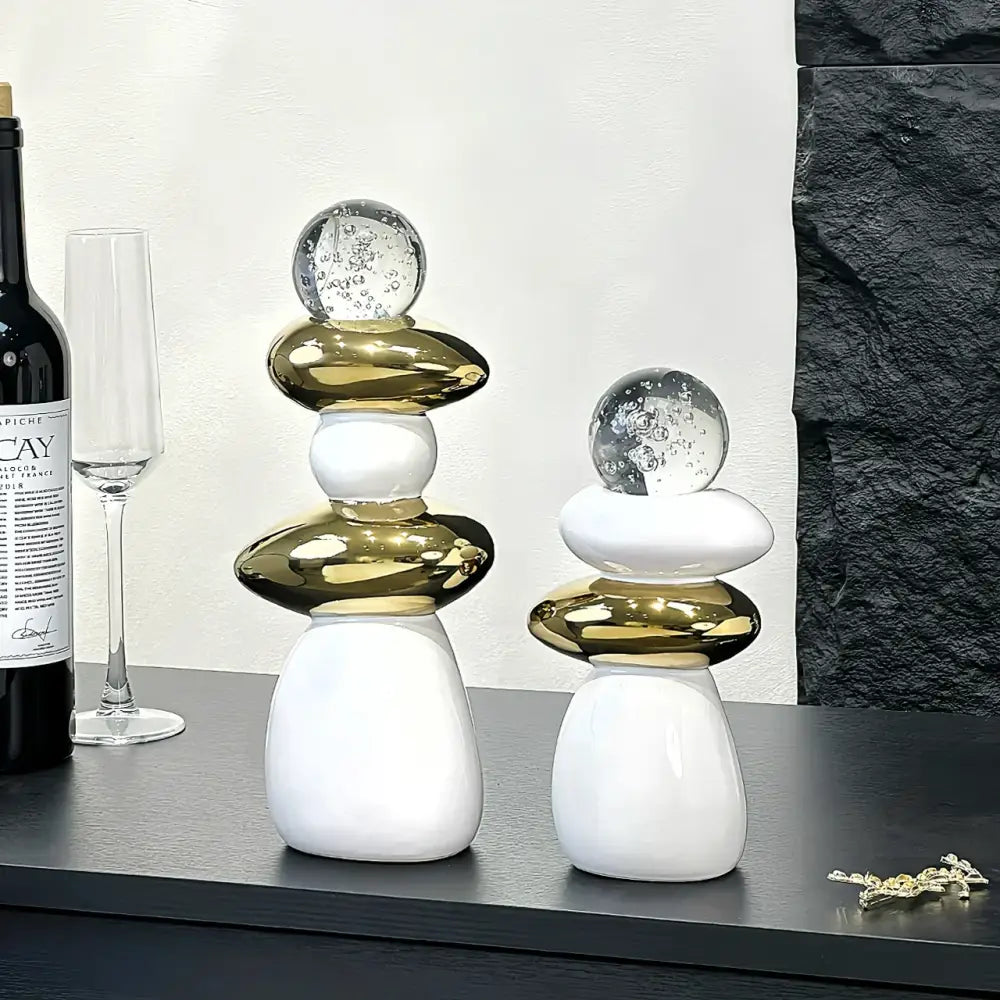 Modern black ceramic decorative crystal ball statue with glossy white resin base and polished gold mid-sections for decorbites decorative crystal decor