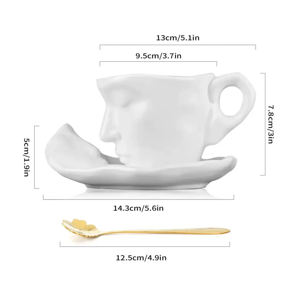 Modern white ceramic tea cup set shaped like a human face with saucer and gold-colored spoon for latte art
