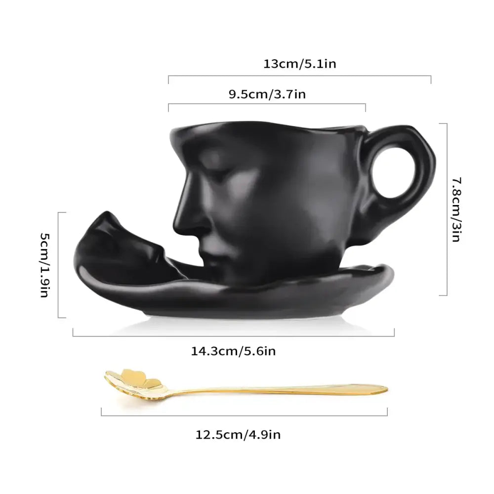 Modern black ceramic tea cup set sculpted with a serene face featuring closed eyes ideal for latte art and dining room use