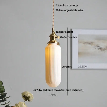 Modern black ceramic led pendant light with warm cream ceramic shade vertical ridges and brass copper socket decorbites black ceramic