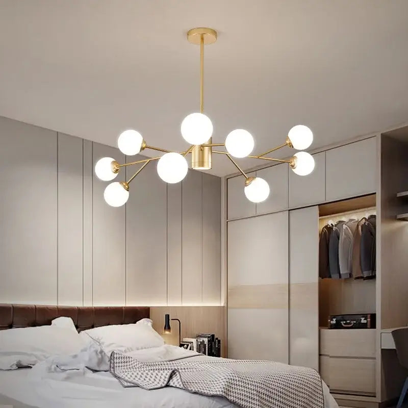 Modern black chandelier by decorbites with gold-toned frame and frosted glass globes for living room decor