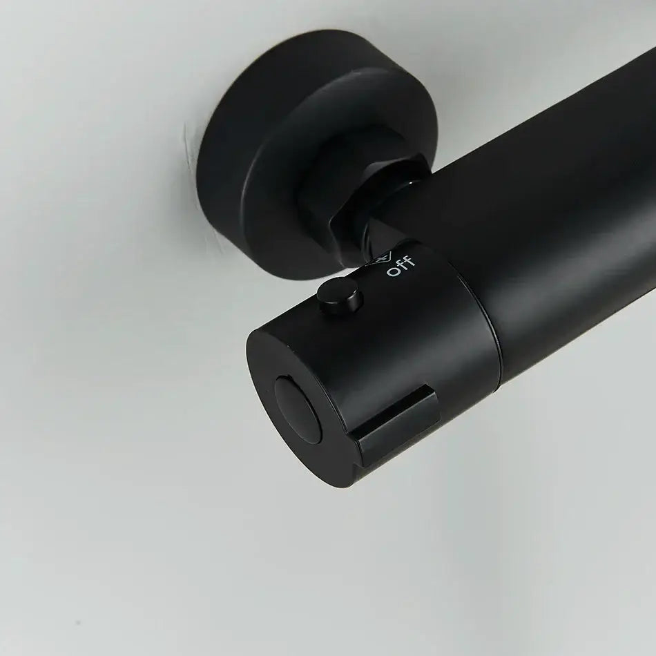 Modern black chrome brass shower set with black matte cylindrical wall-mounted light fixture featuring off switch