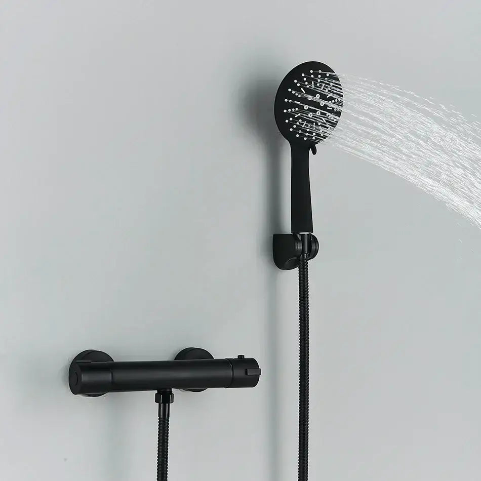 Modern black and chrome brass shower set with a black matte handheld showerhead featuring multiple spray nozzles by decorbites black chrome