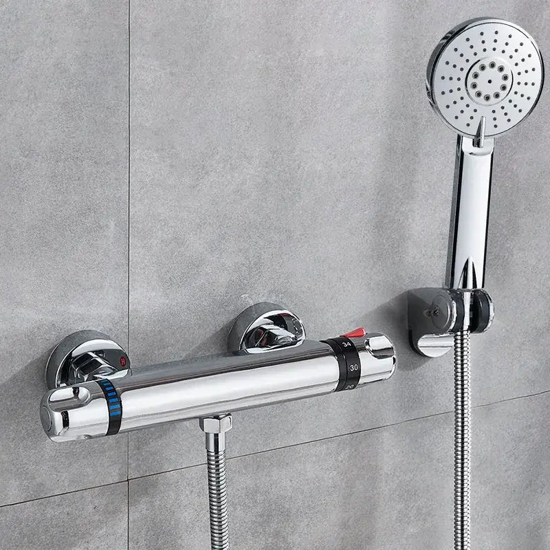 Modern black and chrome brass shower set with chrome finish mixer, circular hand-held spray, and temperature control dial by decorbites black chrome