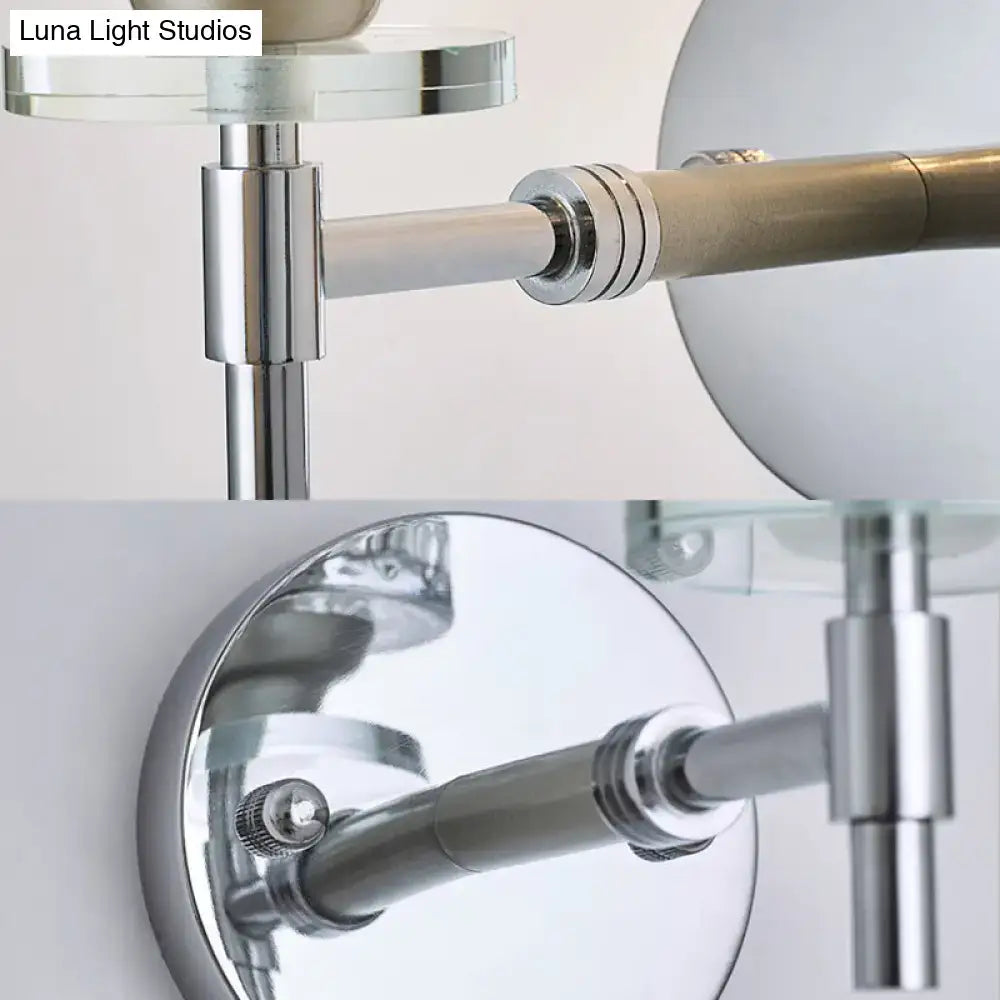 Modern black and chrome dimpled glass cylinder wall sconce with chrome finish and glass accents, adjustable and wall-mounted vanity mirror