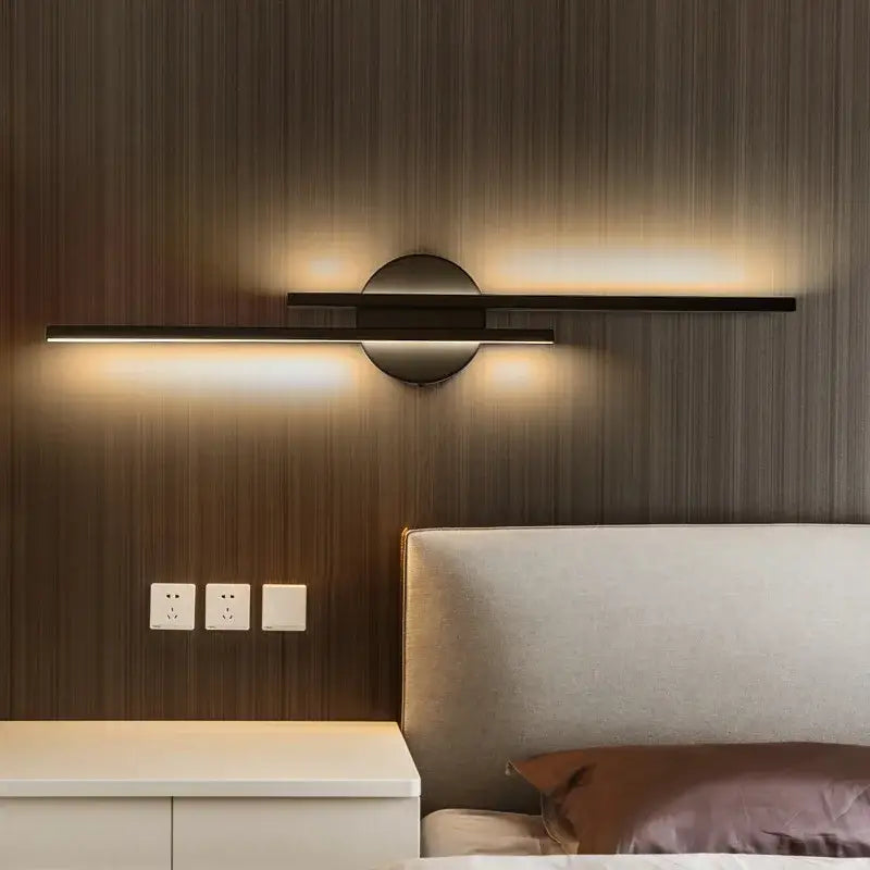 Modern black and chrome decorbites led strip wall light with sleek horizontal bar and circular accent for bedroom decor