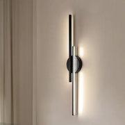 Modern black and chrome led strip wall light with minimalist vertical bars emitting warm light for bedroom decorbites led strip