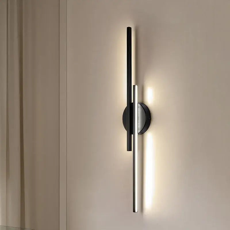 Modern black and chrome led strip wall light with minimalist vertical bars emitting warm light for bedroom decorbites led strip