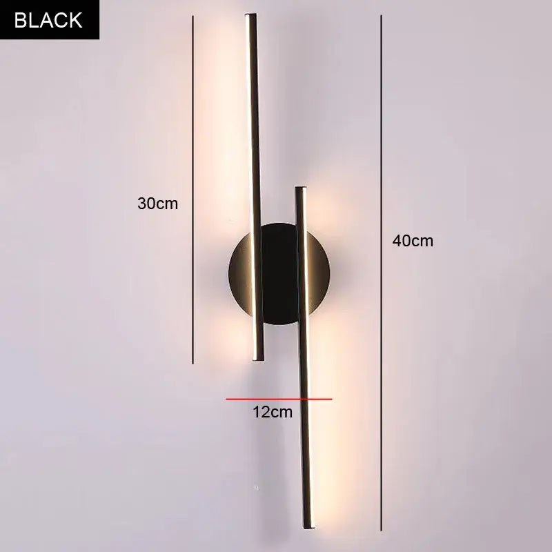 Modern black and chrome decorbites led strip wall light with two vertical metallic rods emitting warm light for bedroom decor
