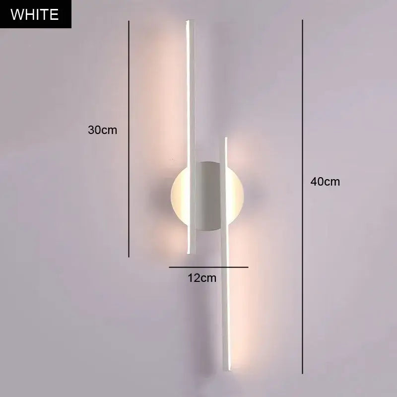 Modern black and chrome led strip wall light with white minimalist rods and circular base emitting soft ambient light