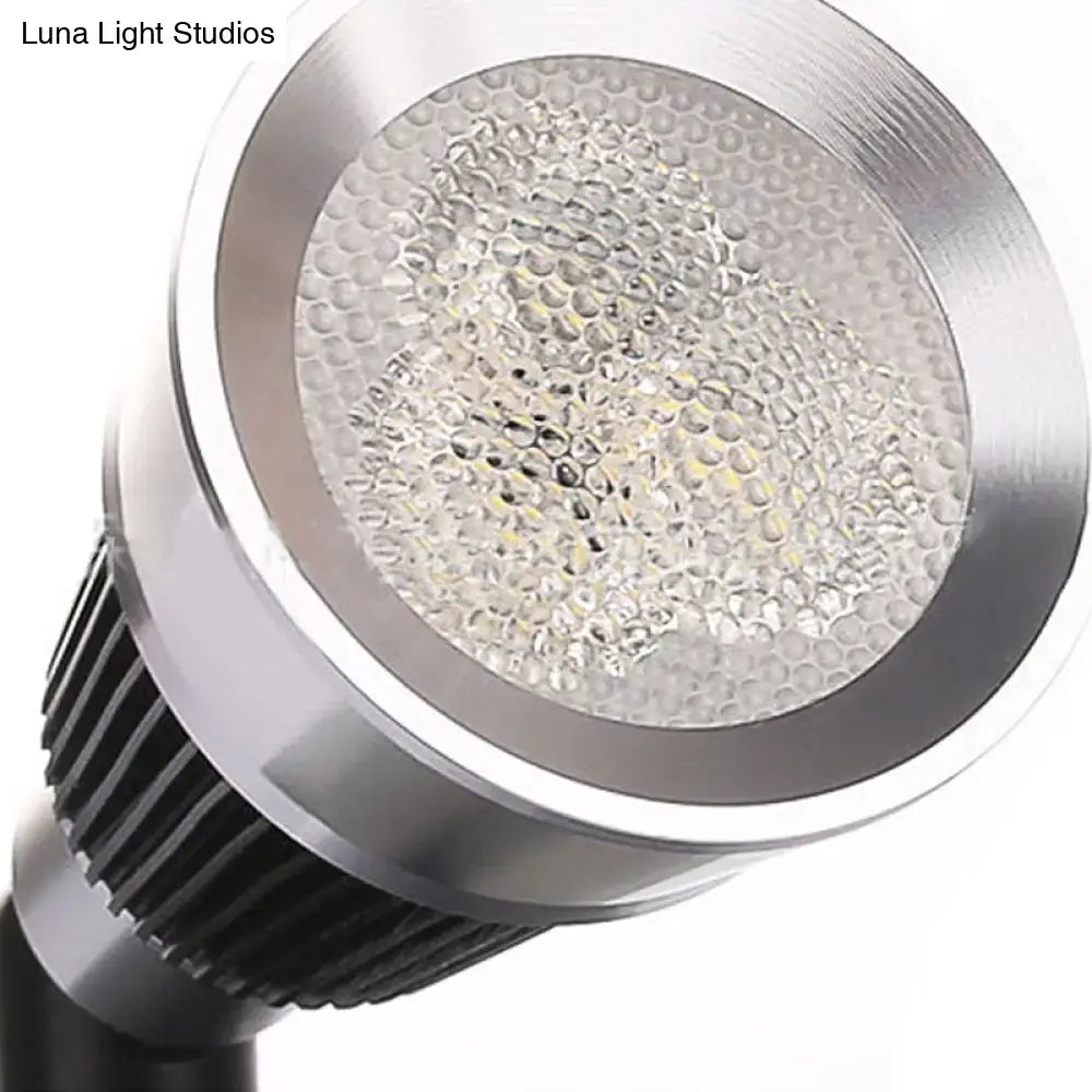 Modern black and chrome smd wall light with silver led spotlight, honeycomb diffuser, and black heat sink fins
