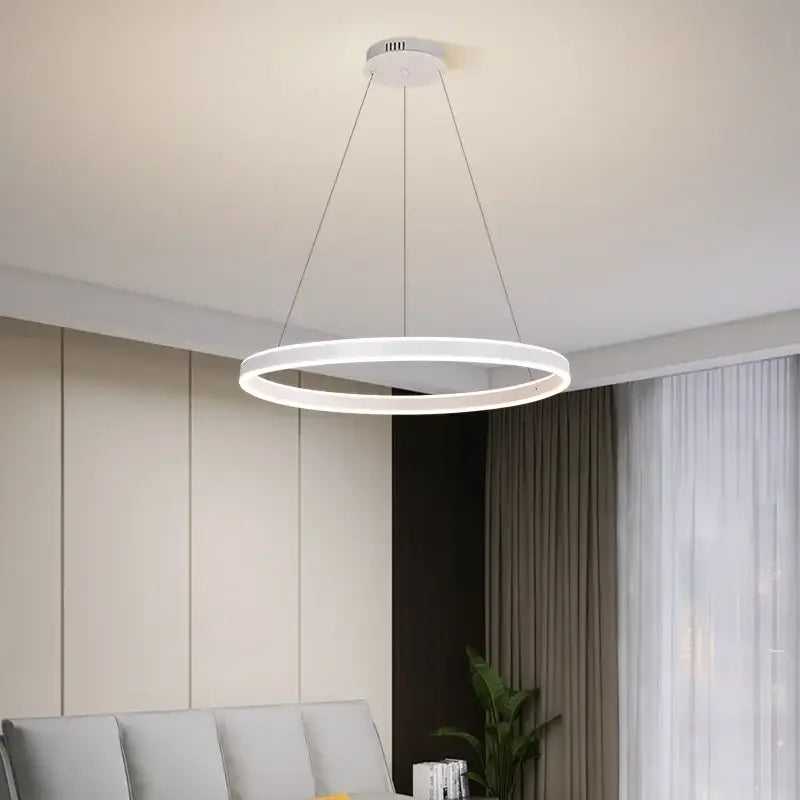 Modern white circular led ceiling light with sleek minimalist design for living room decorbites circle pendant chandelier