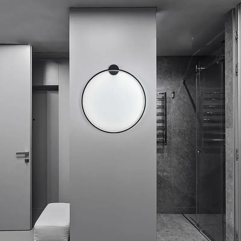 Modern black circular led wall lights with sleek frame providing warm bedroom illumination by decorbites led wall