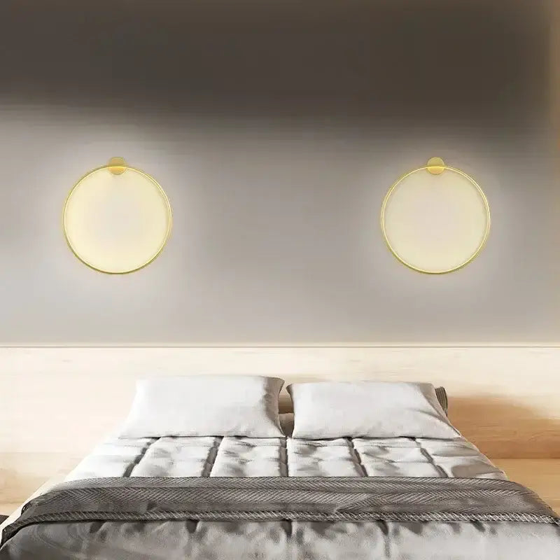 Modern black circular wall lamp with warm led light and gold-toned decorbites circular wall lamp frames for living room decor