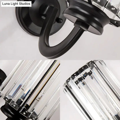 Modern black clear crystal drum wall lamp featuring a wrought iron sconce with clear crystal prisms for living room use