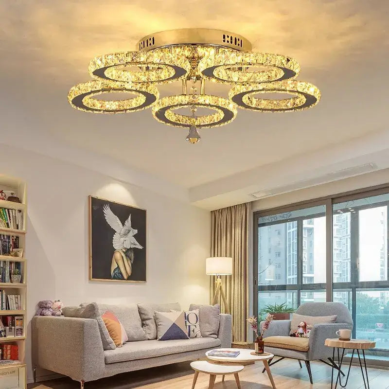 Gold-toned crystal led ceiling chandelier with multiple concentric rings and central pendant for modern decorbites crystal led lighting