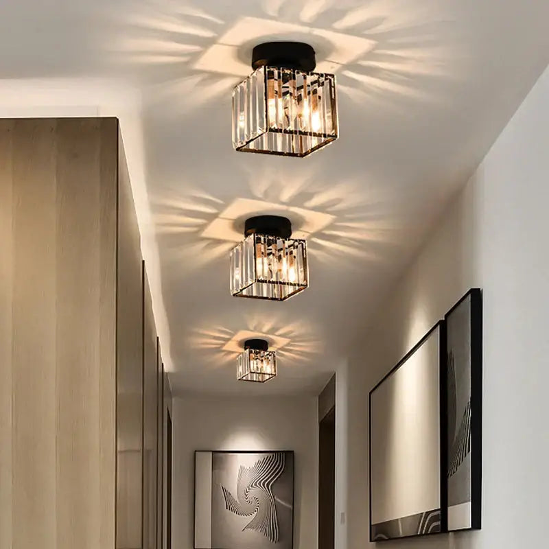Modern black and clear crystal led ceiling light with vertical glass rods and warm radiant illumination by decorbites crystal led