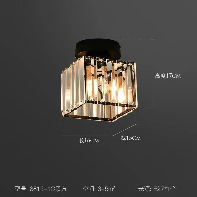 A modern black decorbites crystal led ceiling light with clear faceted glass panels in a geometric cube design