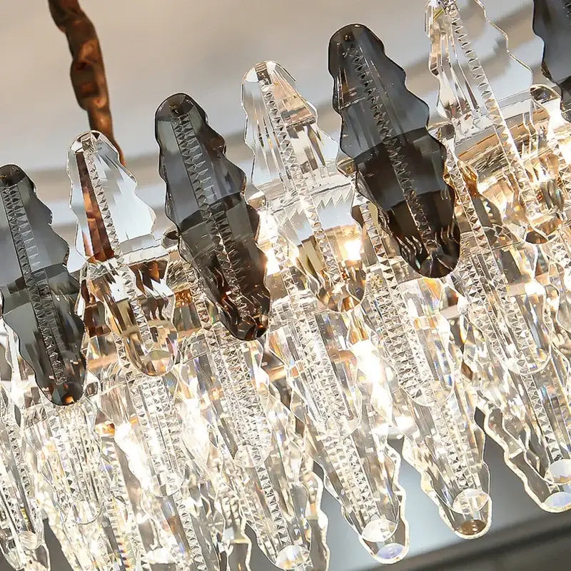 Modern black and clear diamond crystal chandelier pendant lamp with cascading faceted crystal prisms in smoky gray tones