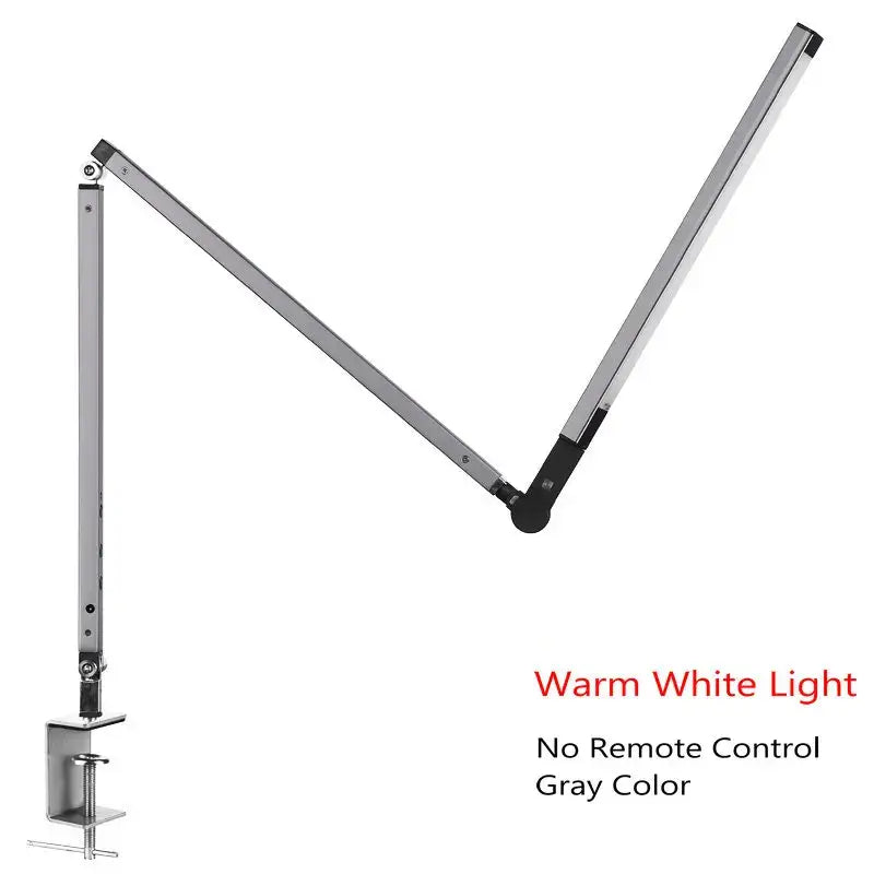 Modern black clip led desk lamp with gray metallic adjustable arm and clamp base providing warm white light ideal for office use