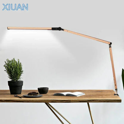 A sleek rose gold articulated desk lamp with adjustable arms complementing decorbites clip led desk office light